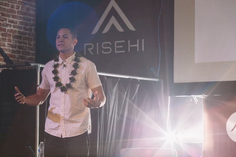 Gabe Amey welcomes the audience to RISEHI's inaugural event.